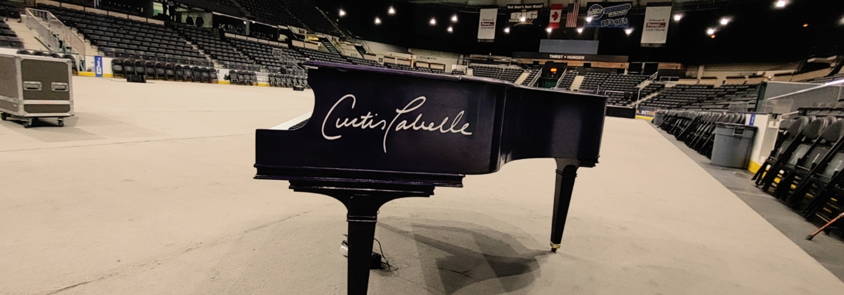 Curtis Labelle's Piano on stage at Westerner Park for Red Deer International Powwow 2022.